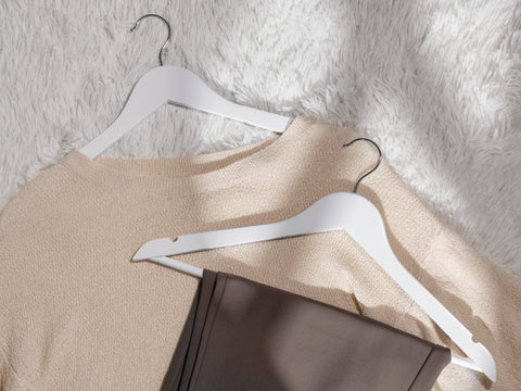 StorageWorks solid wood coat hanger provides sturdy support for heavy garments.