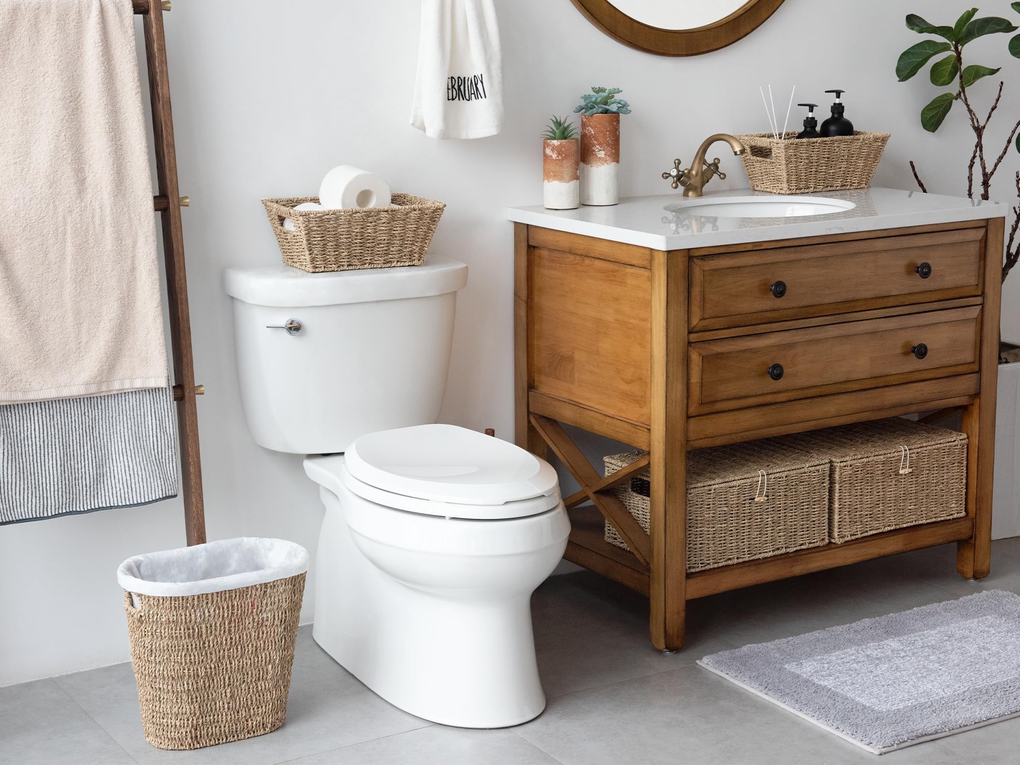 StorageWorks wicker waste basket in a bathroom for tidy waste collection.