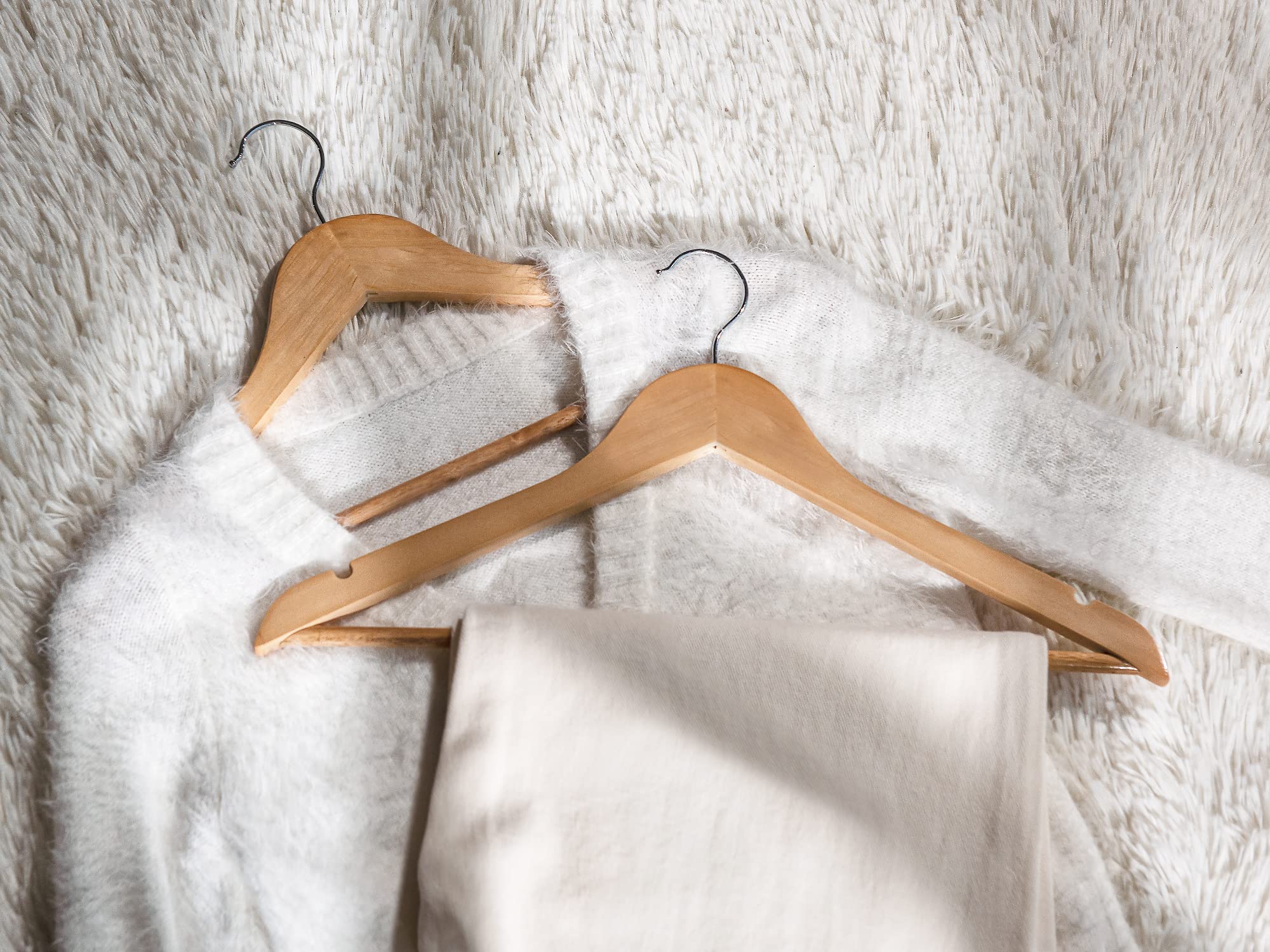 StorageWorks heavy-duty hanger supports bulky coats and suits with ease.
