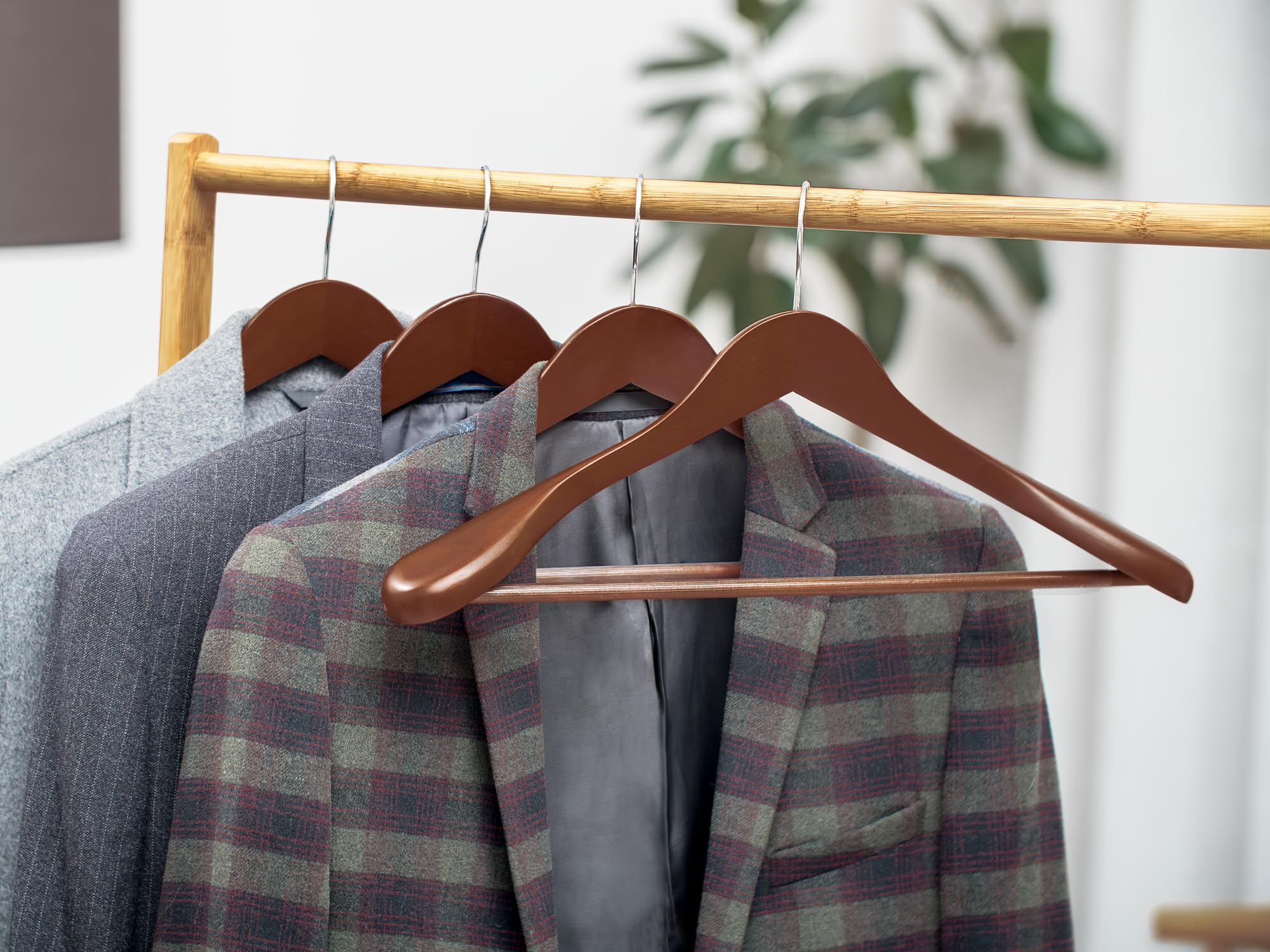 StorageWorks hanger with light walnut finish adds warm closet aesthetic