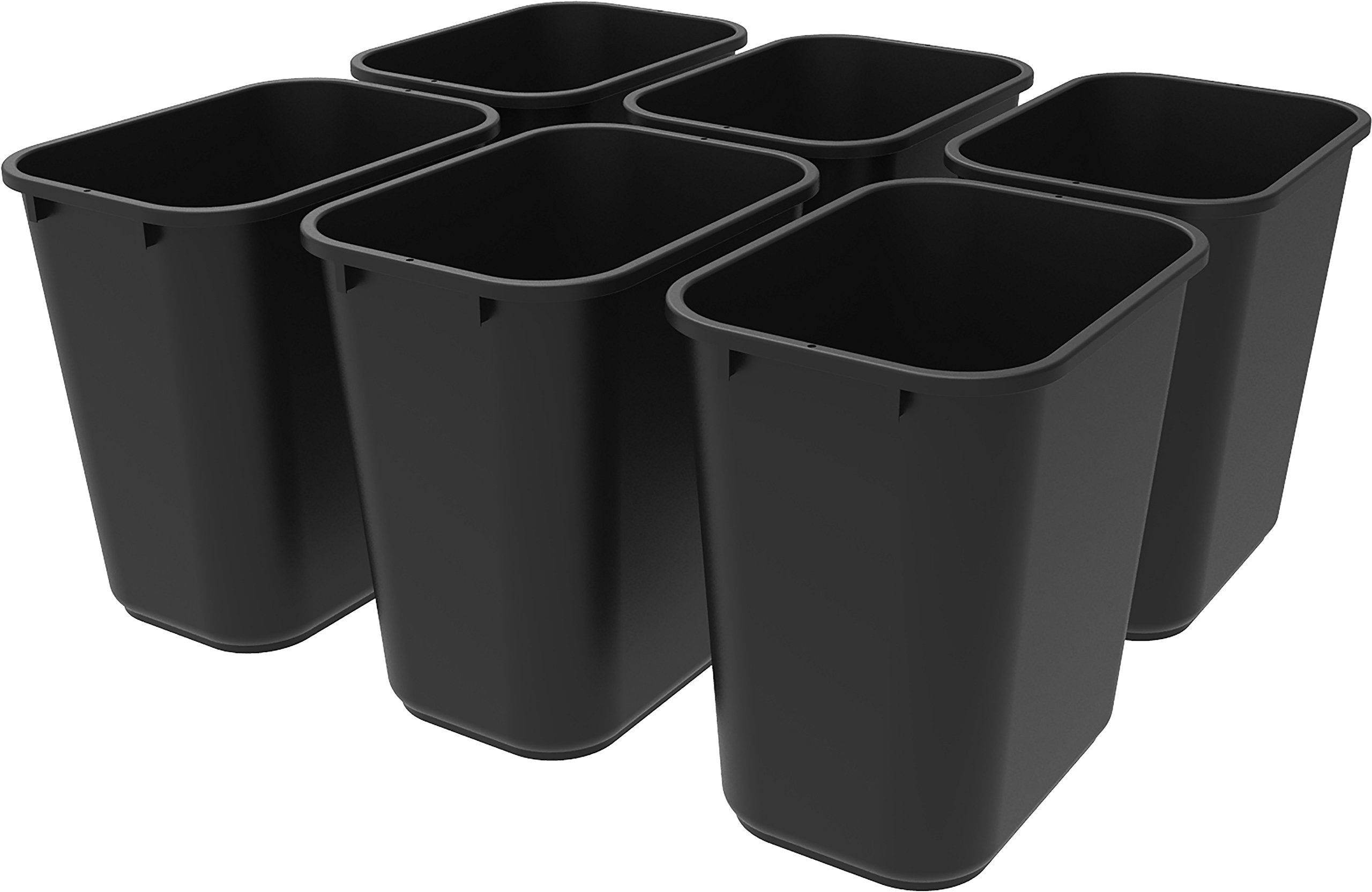Storex 7-gallon gray trash can under a desk, ideal for compact spaces.