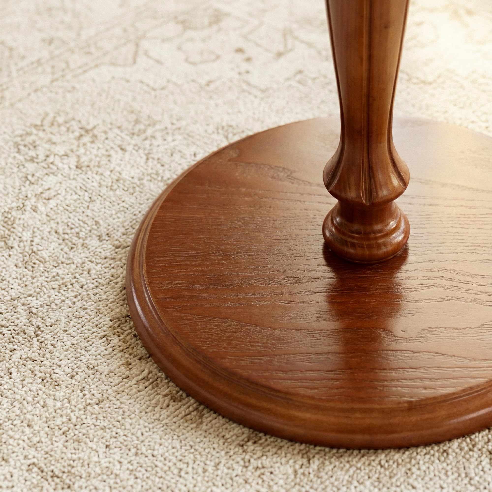 STO'SENSE sculpted pedestal design elevates any living space with grace