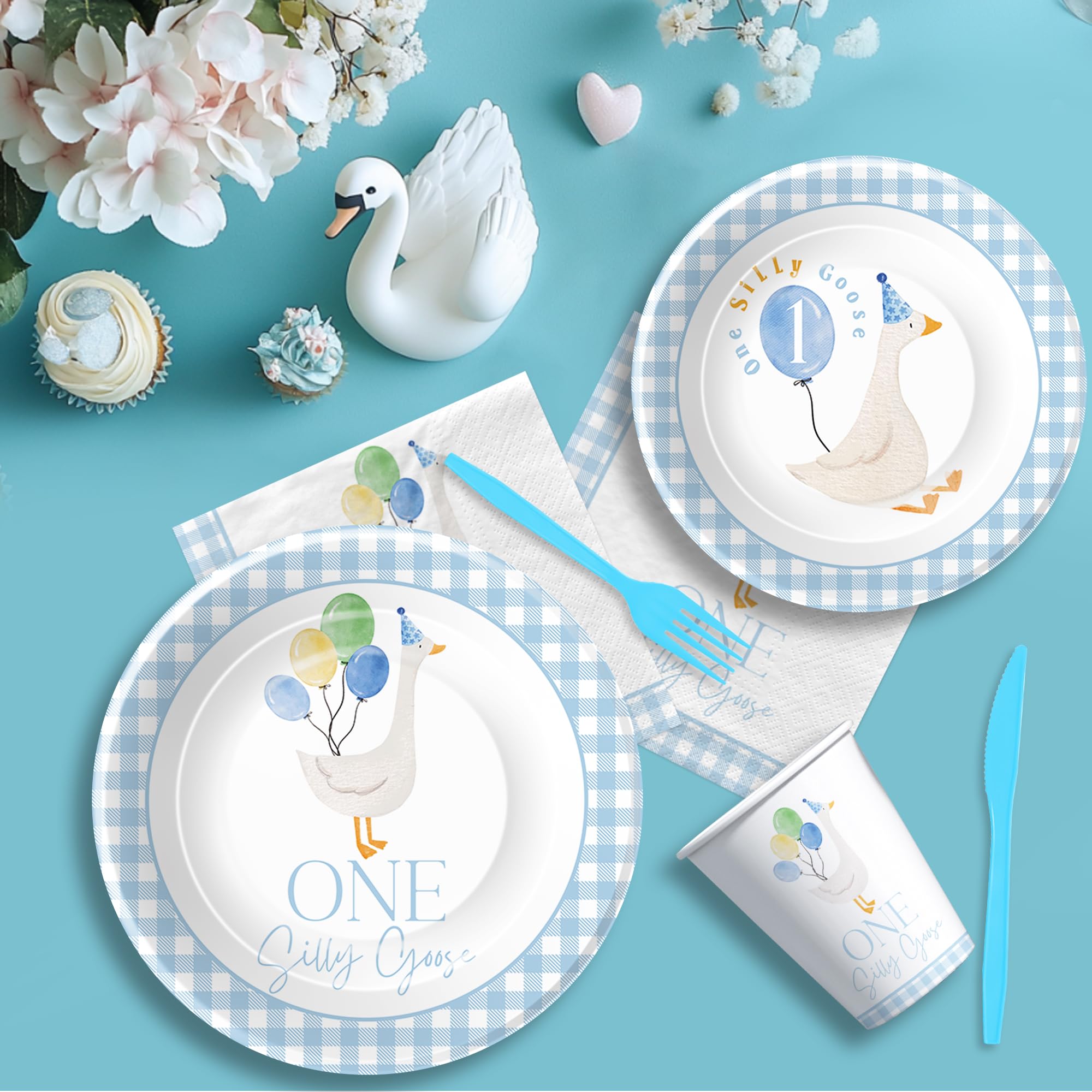 Suhelkit blue tablecloth ties the goose theme across the table.