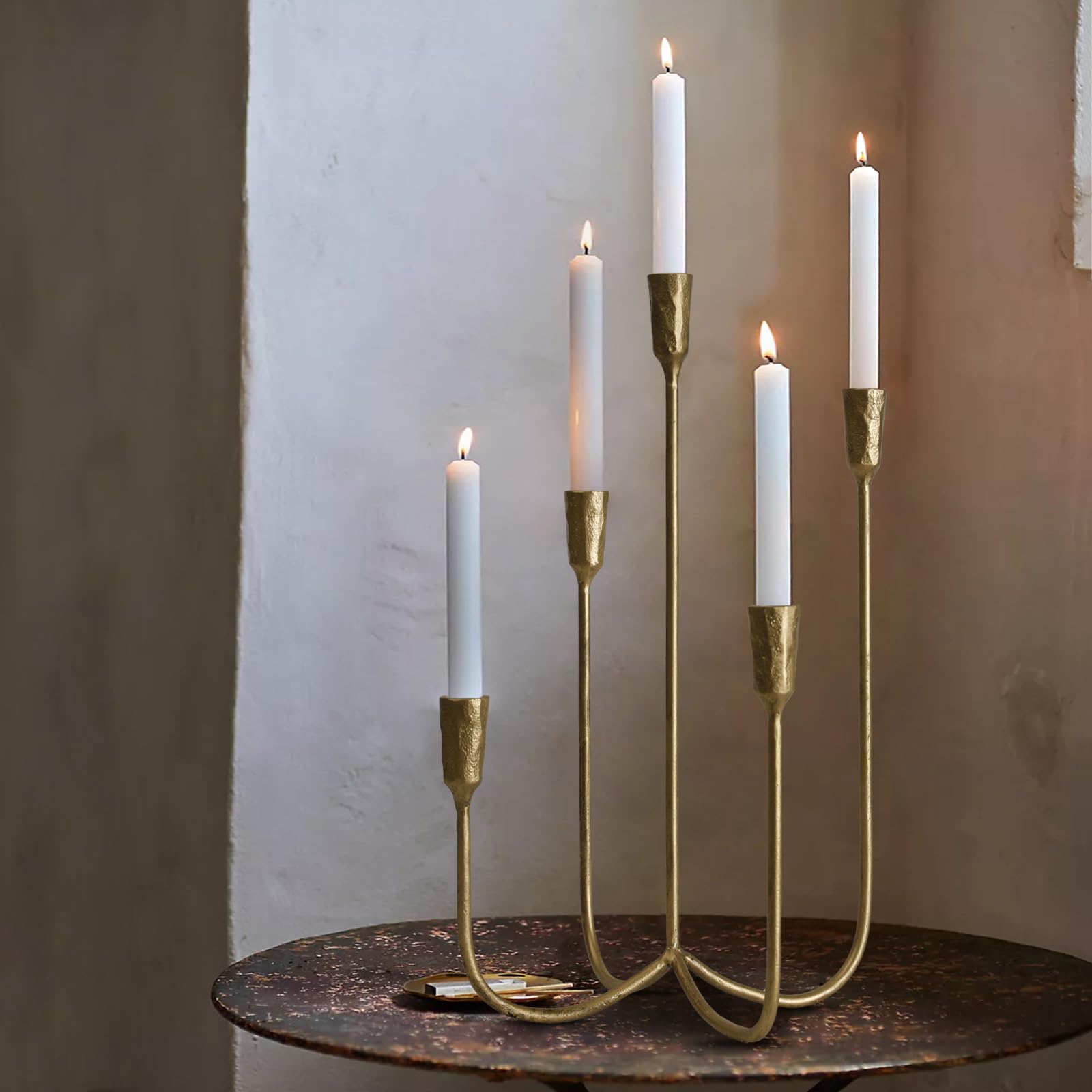 SUJUN brass gold candelabra on a clean table