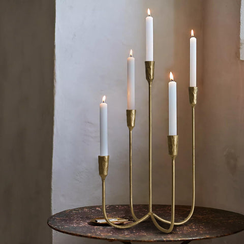 SUJUN brass gold candelabra on a clean table