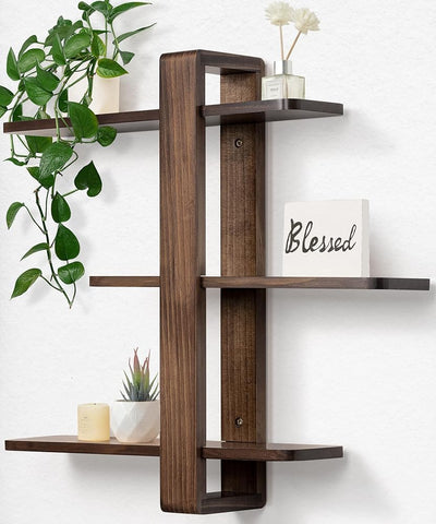 SUMGAR walnut three-tier floating shelves mounted on wall for stylish storage.