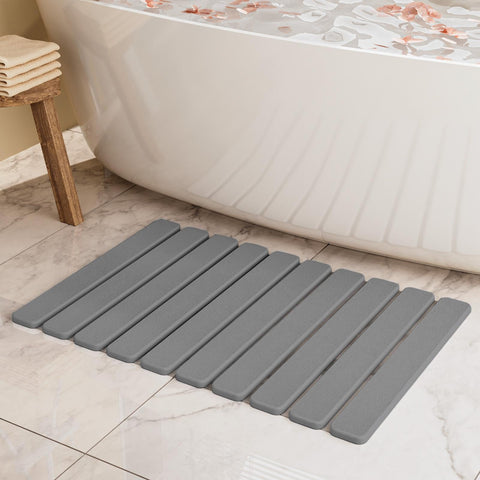 Summer&Kiss foldable stone bath mat with quick-dry surface for dry feet.