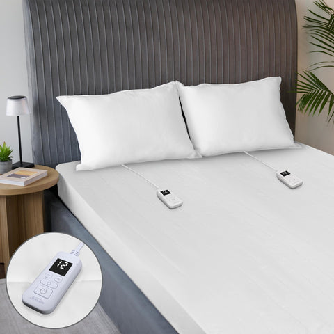 Sunbeam Restful quilted heated mattress pad on bed for instant cozy warmth all night.