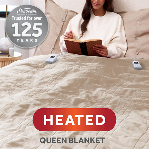 Sunbeam Royal Posh Velvet blanket with blue LED controller shown at night