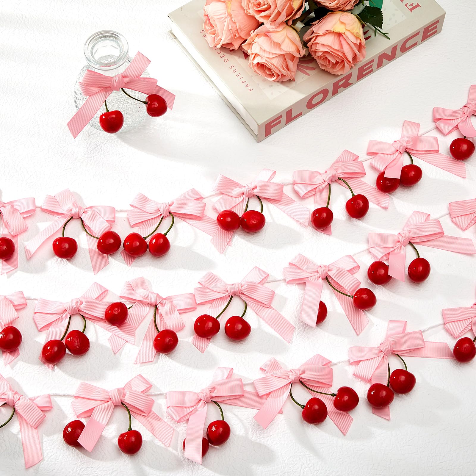 Suncalla cherry bows roll displays a long garland ready for banners and celebrations.