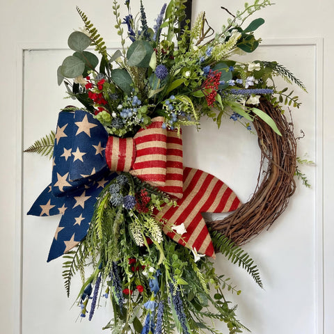Suncalla Patriotic Wreath on front door with burlap bow for curb appeal