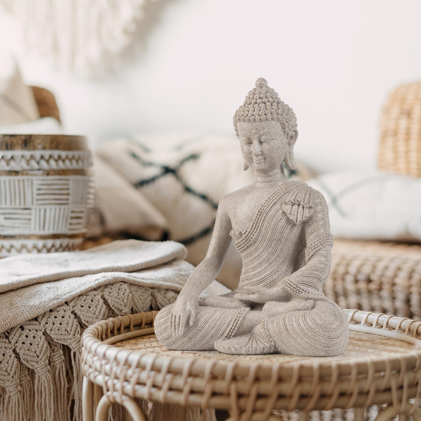 Suoedd Buddha statue placed in a bedroom for peaceful ambiance.