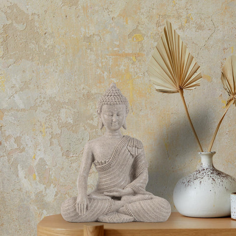Suoedd Buddha statue bathed in sunlight, glass accents gleaming.