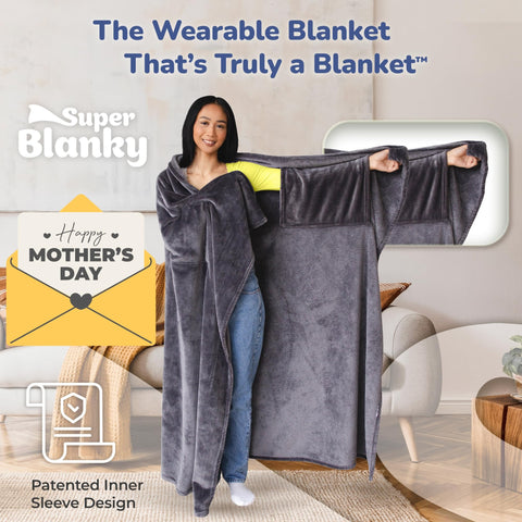 Super Blanky oversized comfort blanket offering full-body warmth on the couch.