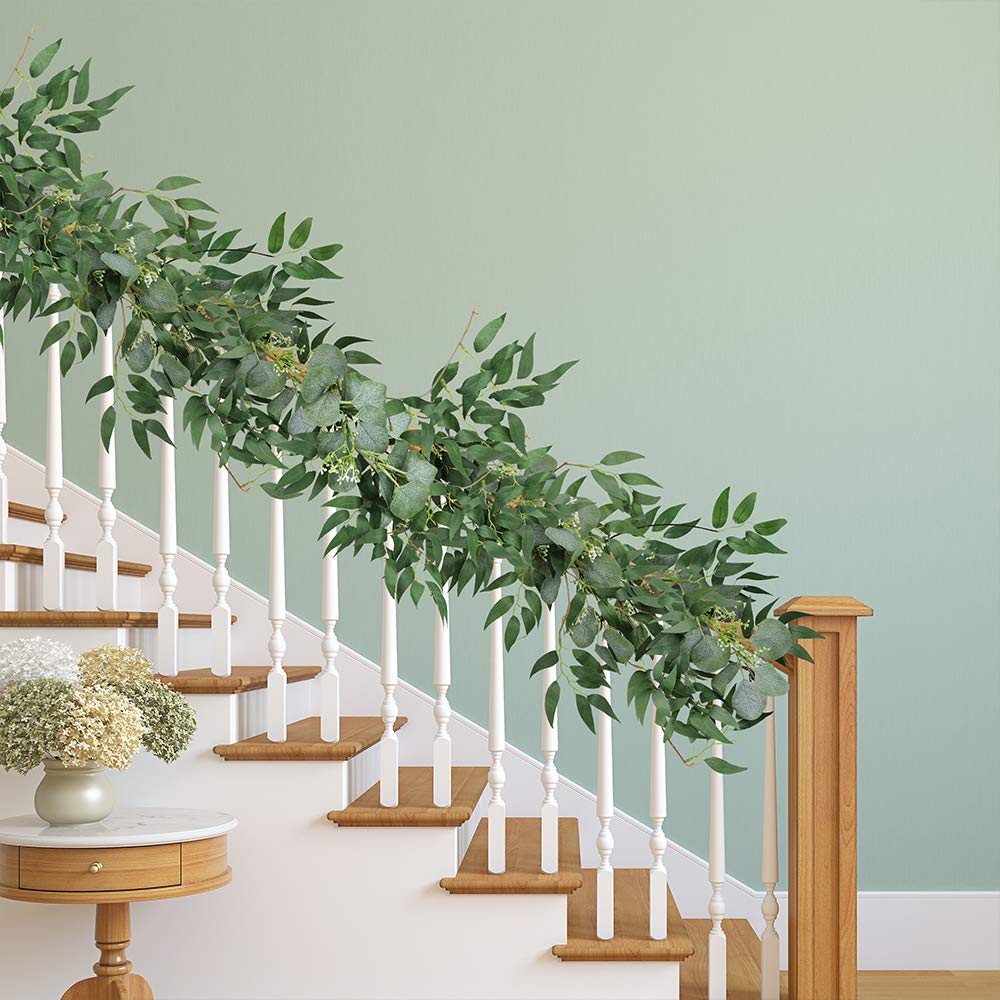 Supla eucalyptus willow garland draped over a fireplace mantel.