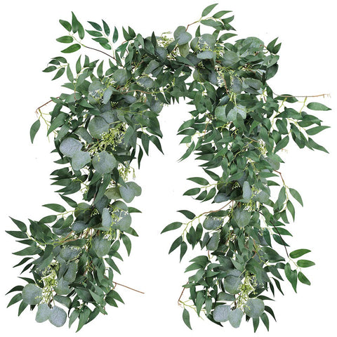 Supla mixed eucalyptus willow garland on arch for rustic wedding backdrop.