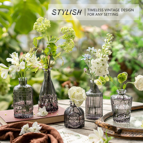Close-up of SUPMIND black glass bud vases showing textured etched detailing
