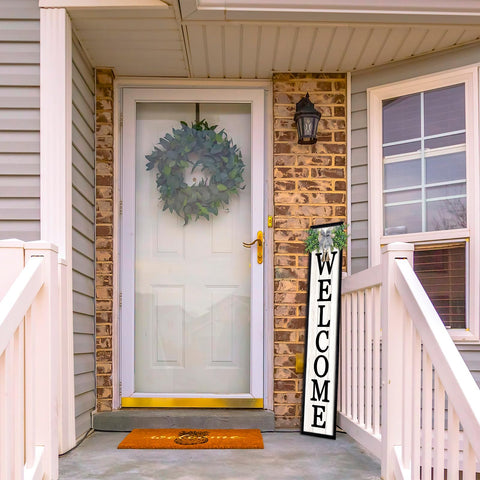 Surfapans large wooden welcome sign enhances porch welcoming feel.
