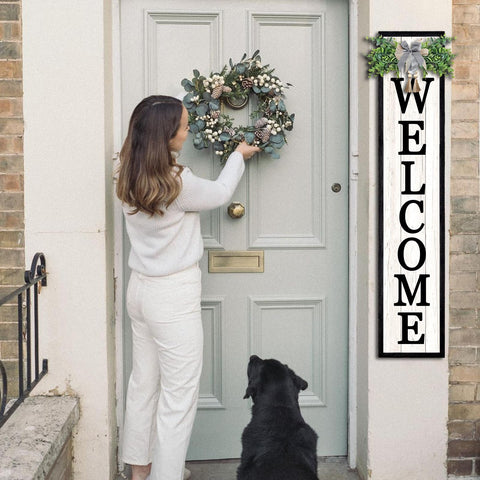 Surfapans plaid bow eucalyptus decor enhances entryway welcome.