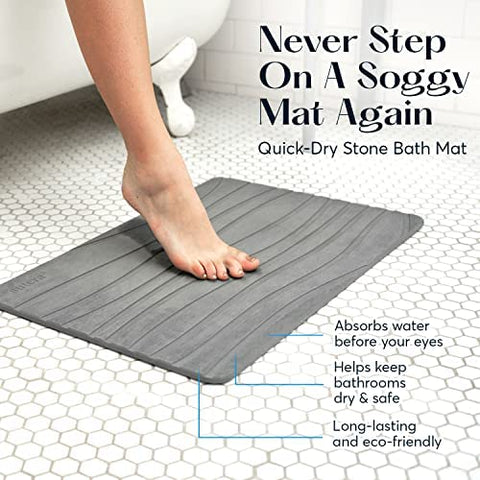 SUTERA Non-slip Gray Bath Mat on the floor shows safer footing.