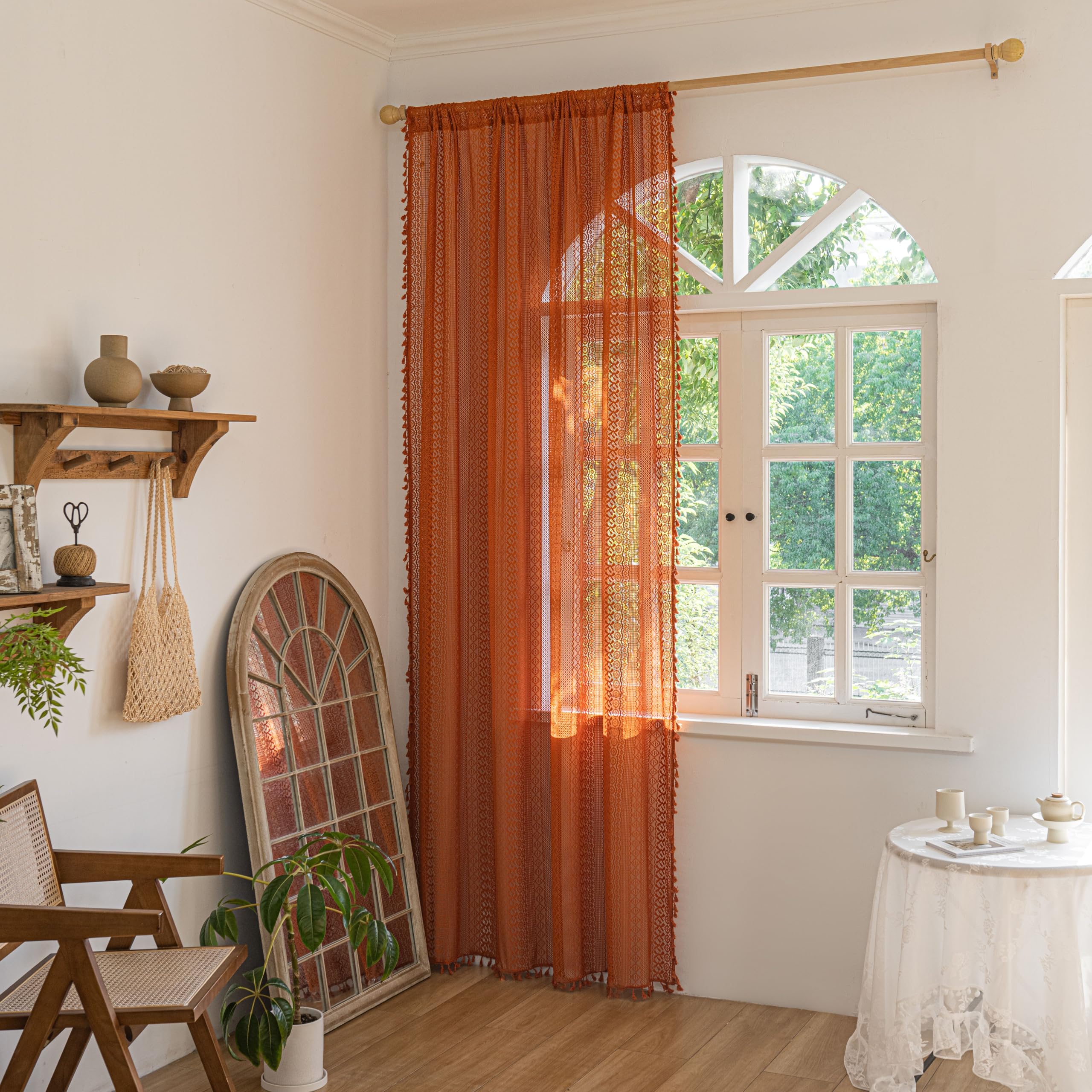 Sutuo Home hollow-out crochet drape with tassels adds decorative texture.