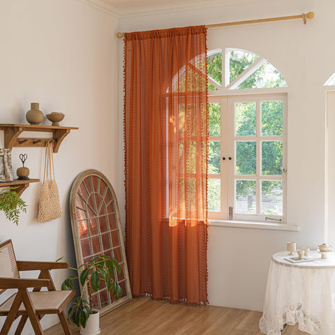 Sutuo Home hollow-out crochet drape with tassels adds decorative texture.