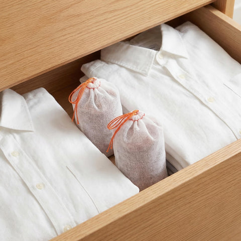 Suwimut cedar sachet in shoe cabinet keeps footwear smelling clean.