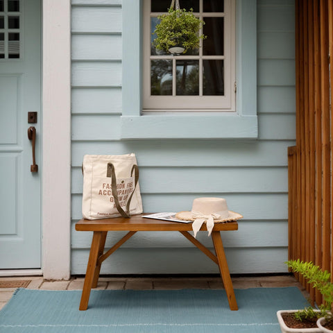 SwallowLiving solid wood bench natural finish closeup, warm tones and craftsmanship.