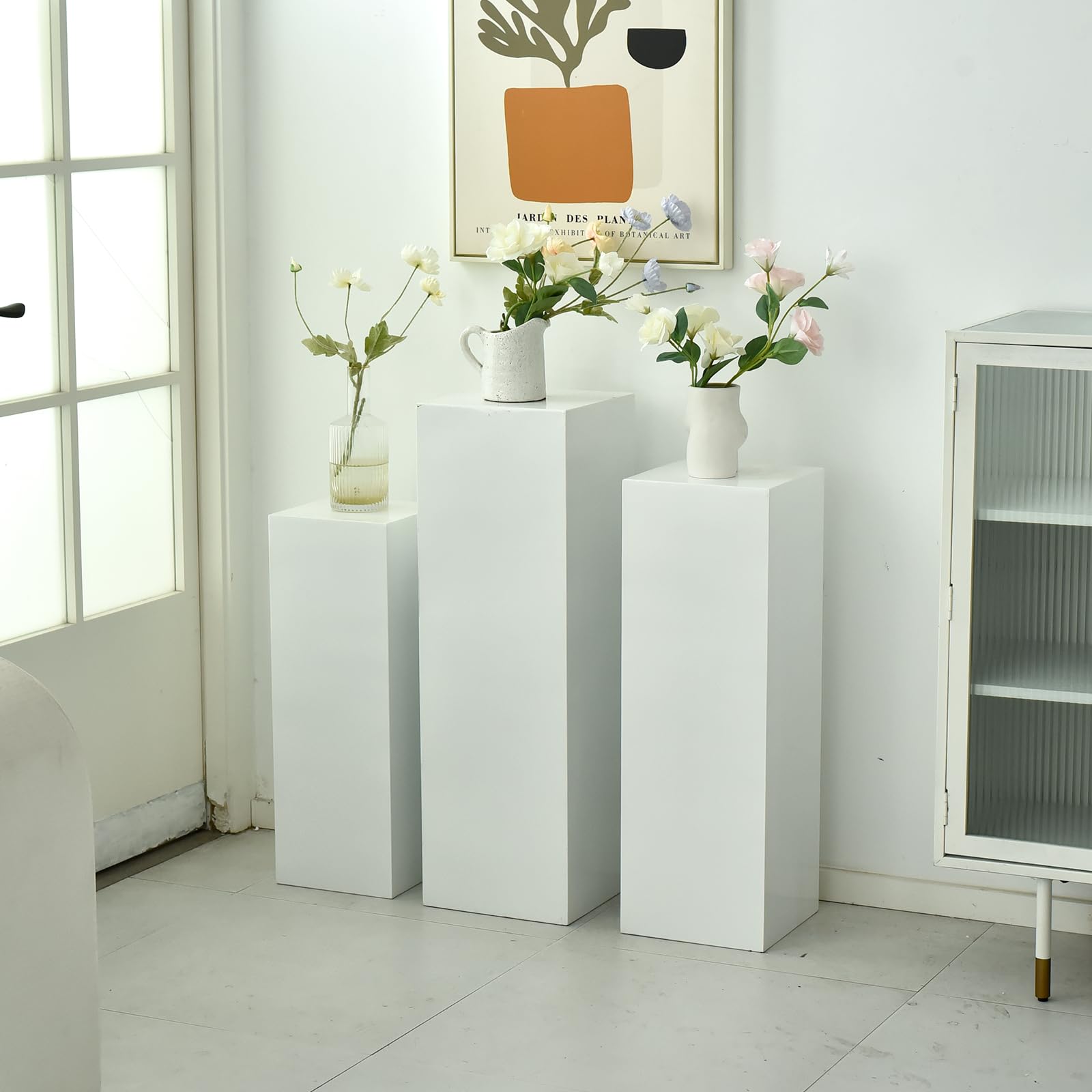 SwallowLiving white pedestal stand large creates a dramatic showcase for sculptures