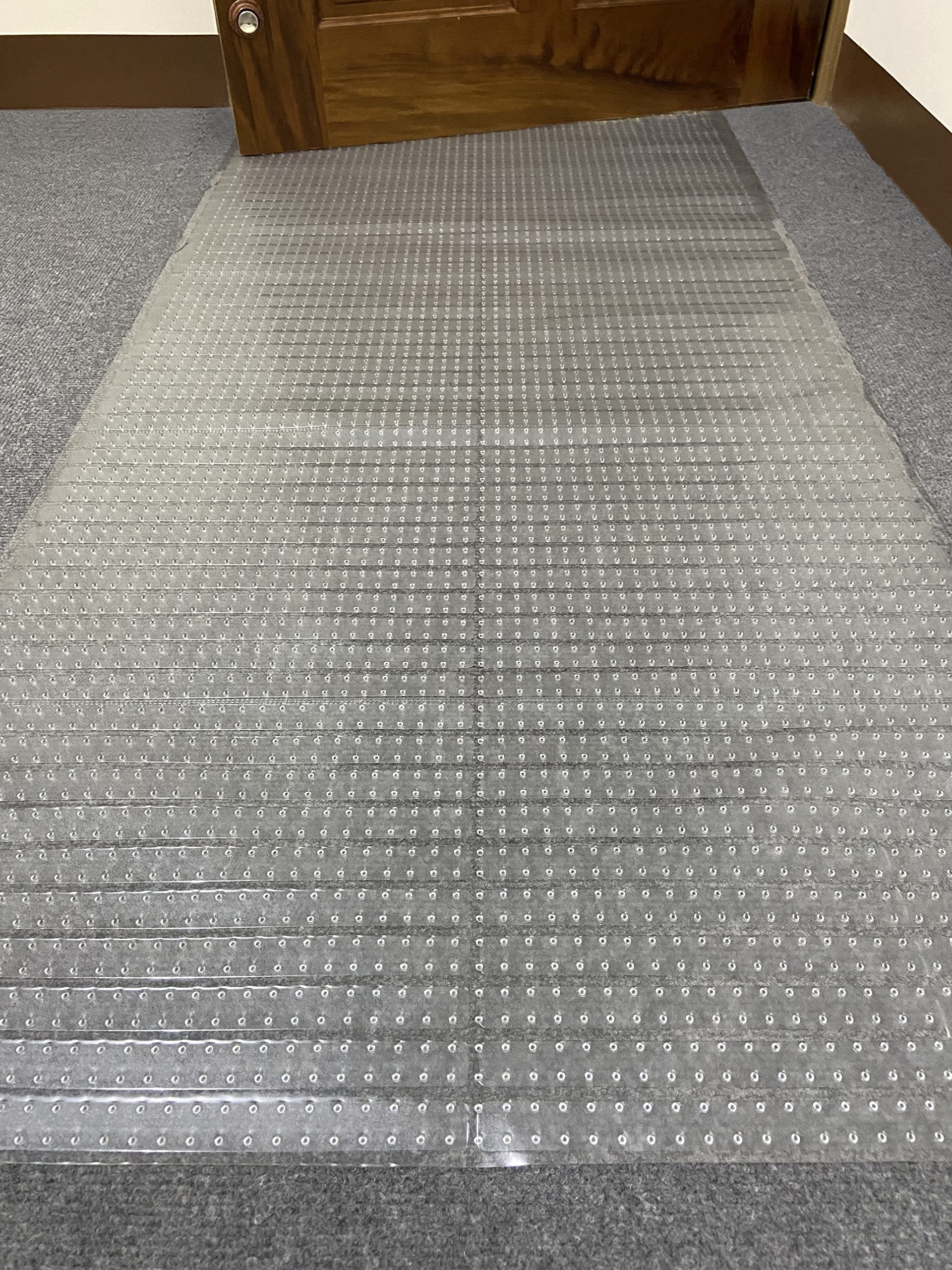 Sweet Home Stores Clear Vinyl Carpet Protector shown on a hallway floor, keeping carpets visible and protected.