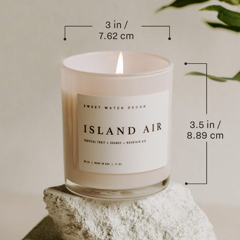 Lit Sweet Water Decor Salt and Sea candle glow creates cozy coastal ambiance