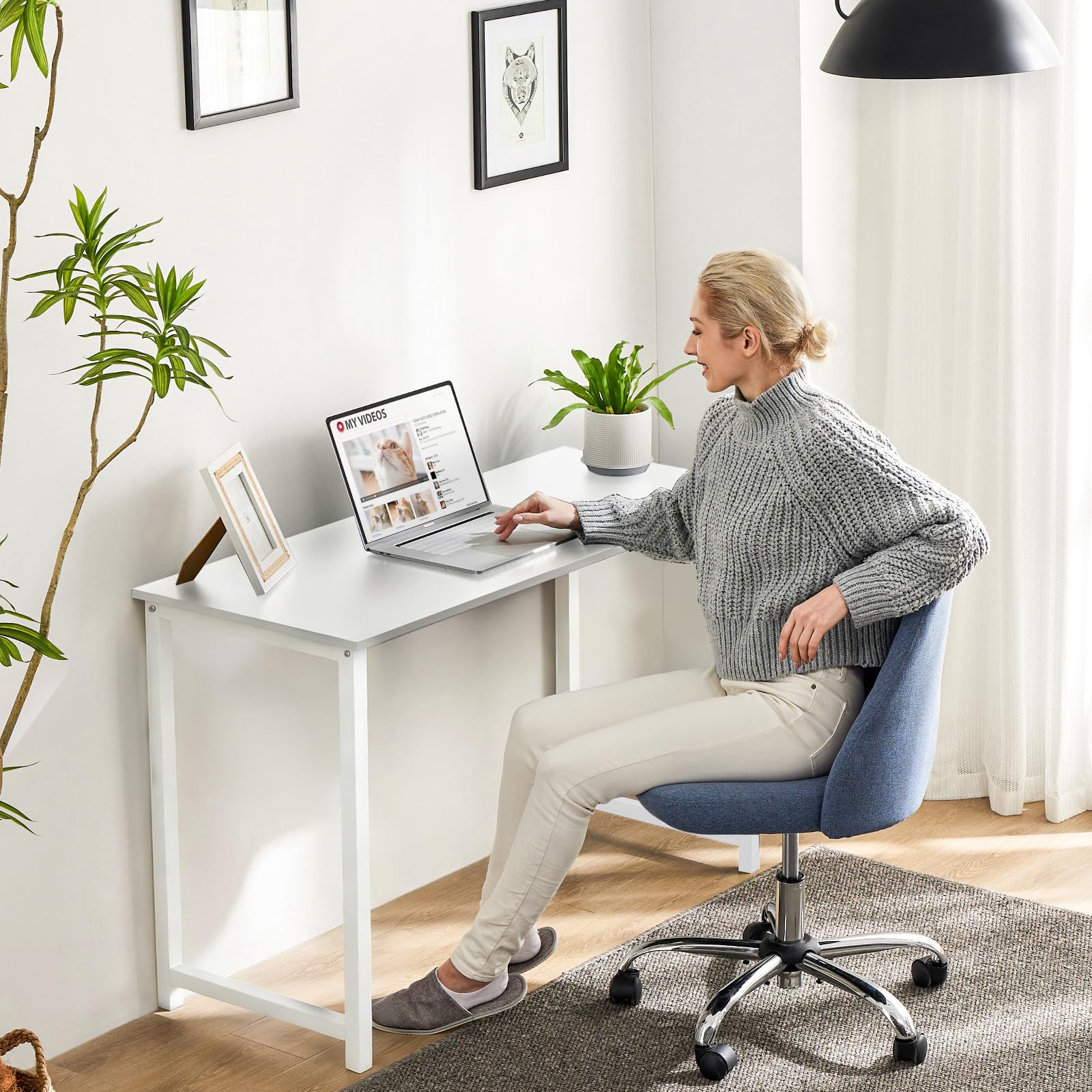 Sweetcrispy desk in bedroom fits small spaces for study or gaming.