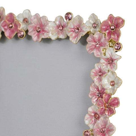 Quality craftsmanship and rhinestone-like details accompany Synovana pink flower frame for 4x6 memories.