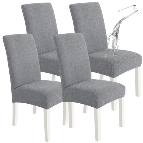 SYSLOON waterproof chair covers in light gray protect dining chairs from spills and stains.