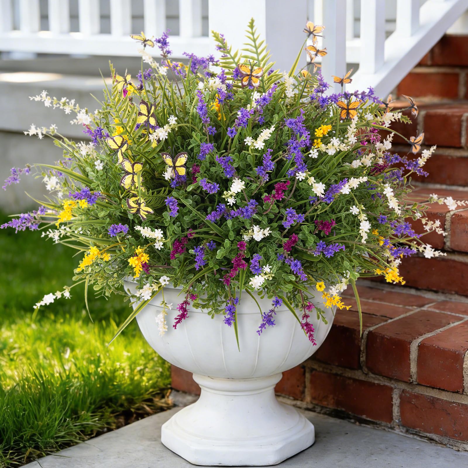 TakeArt butterfly with fake fern plants enhances porch decor with bright, maintenance-free color.