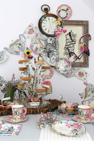 Talking Tables Alice plates feature scalloped edges in pink, blue, and gold