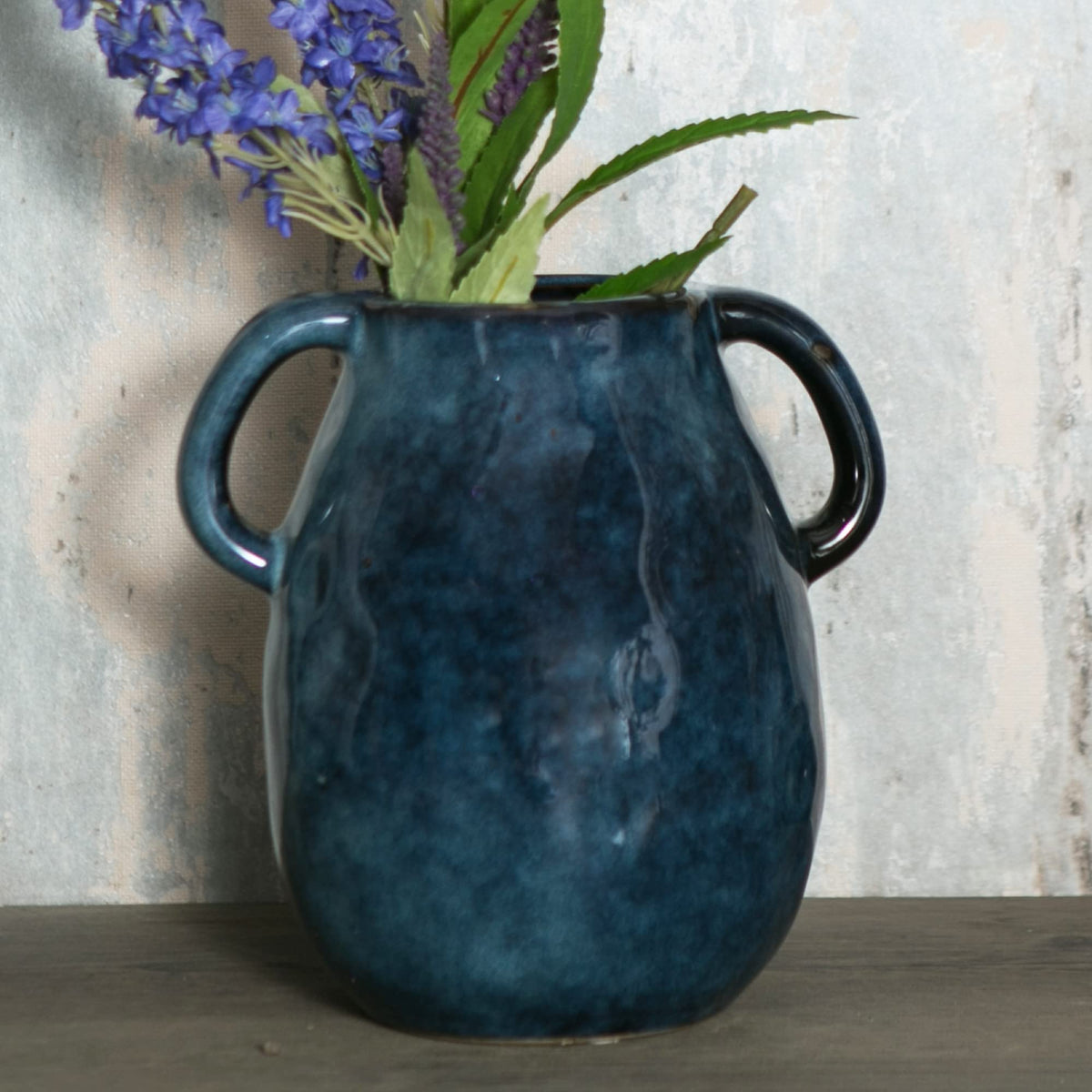 Tanvecle blue ceramic vase with two handles, ideal as a versatile centerpiece.