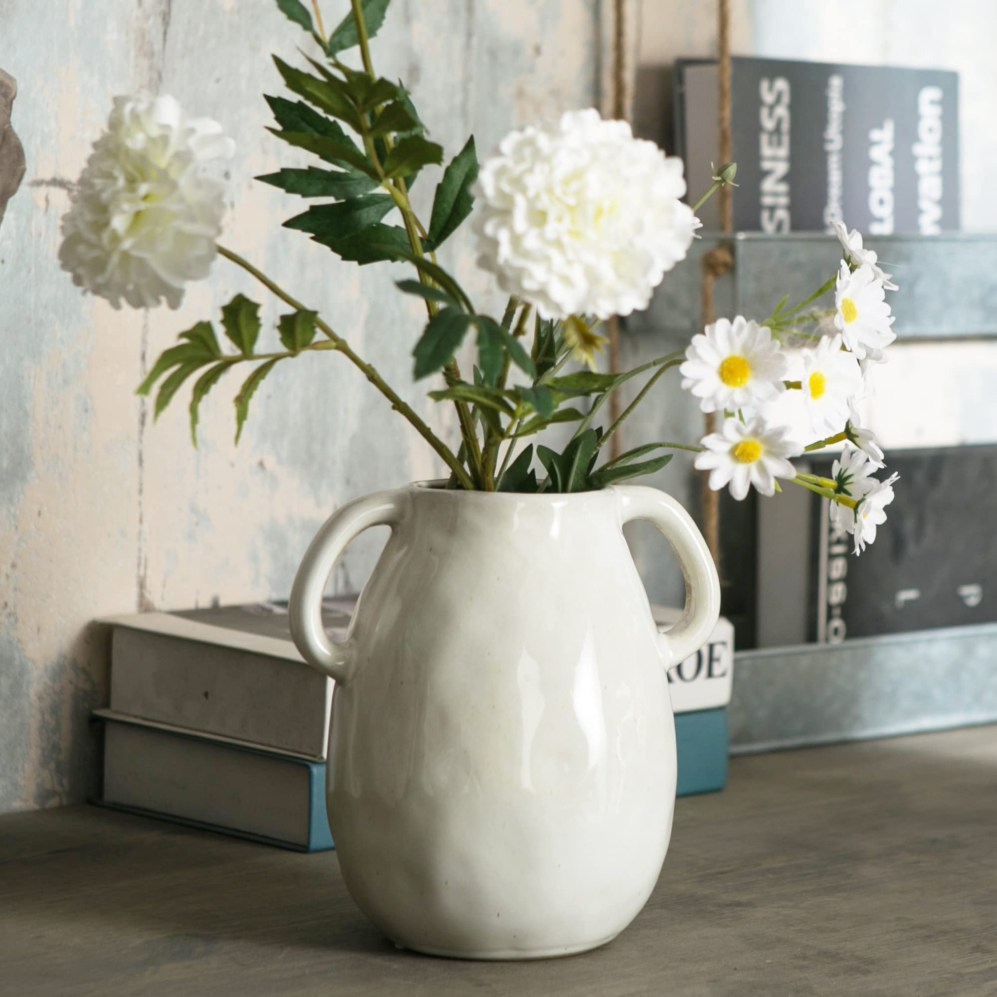 Tanvecle ceramic vase standing on living room shelf as decorative accent.
