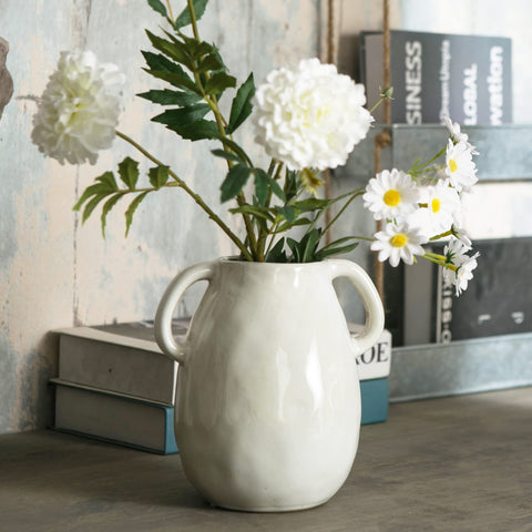 Tanvecle ceramic vase standing on living room shelf as decorative accent.