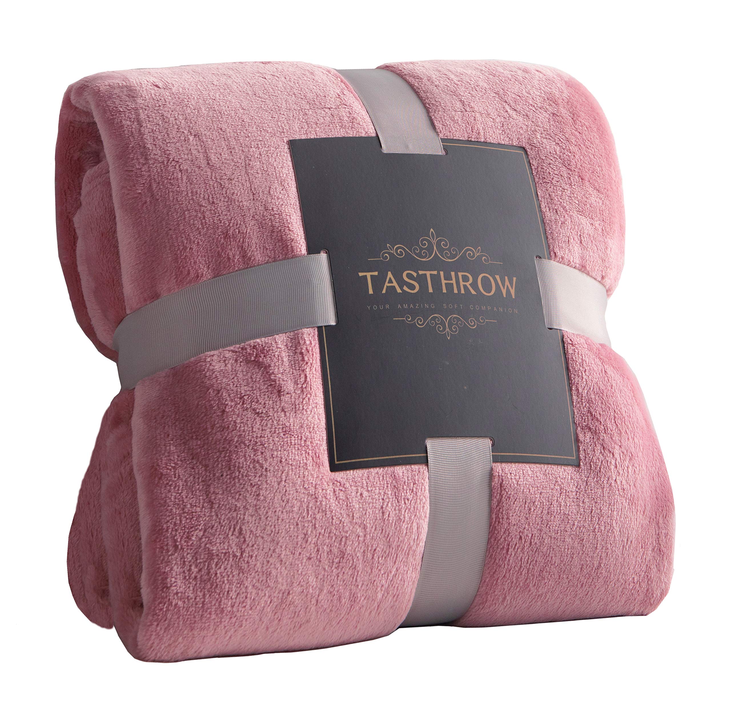 TASTHROW large pink flannel blanket on sofa for cozy lounging