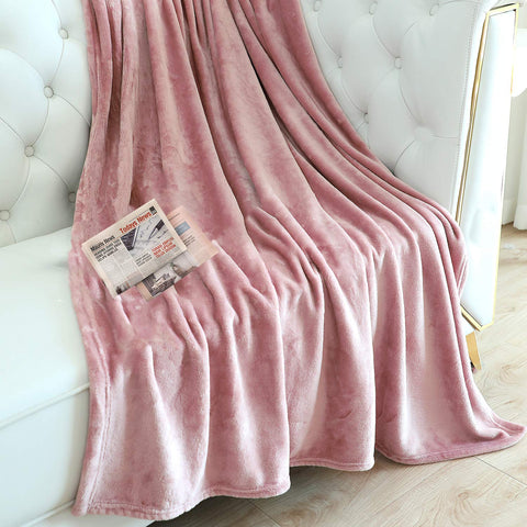 TASTHROW pink fleece throw folded neatly for compact storage