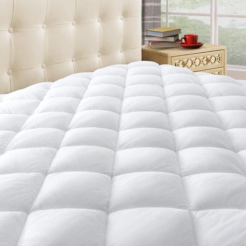 Taupiri queen quilted mattress pad cover on a bed, offering added comfort and protection.