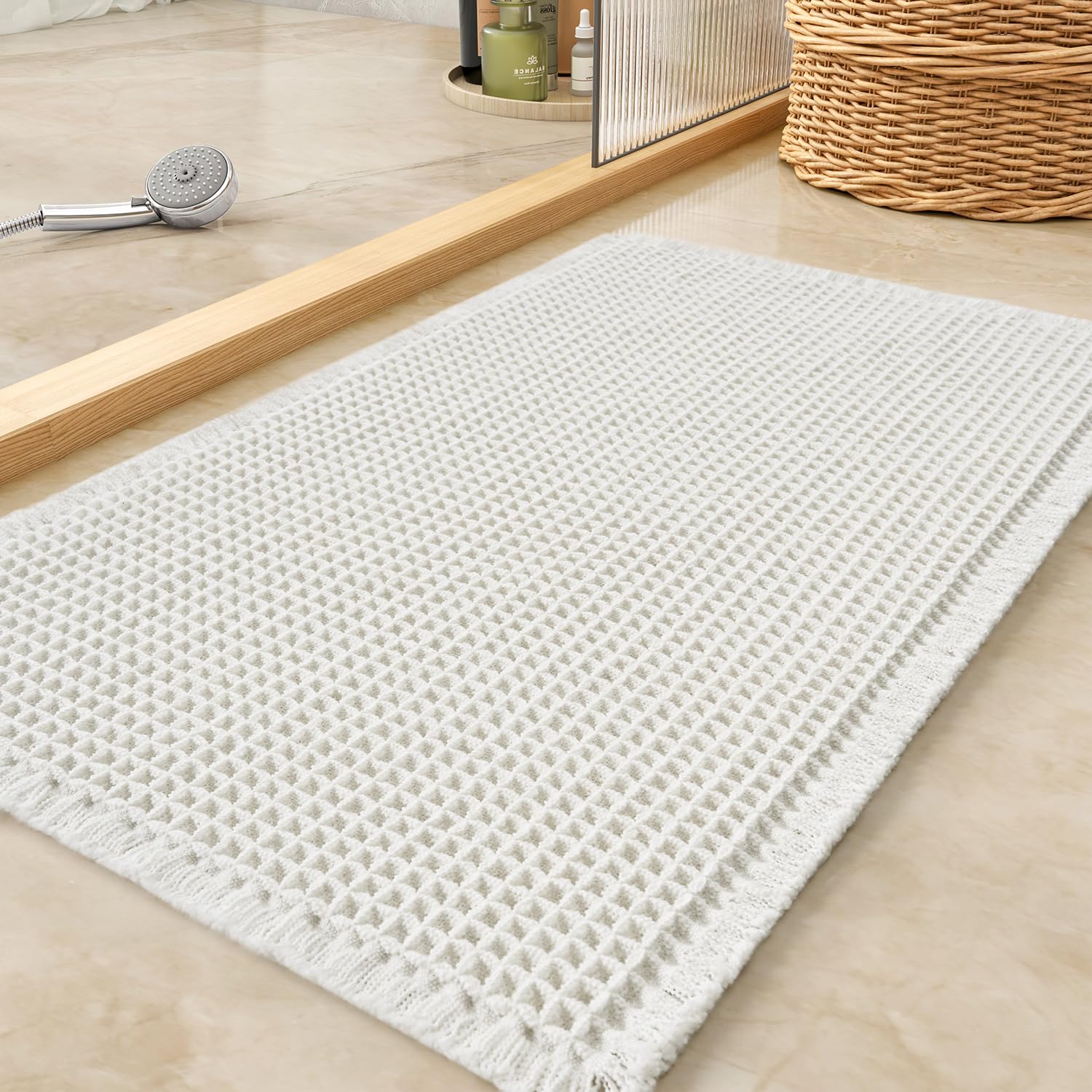 Tchdio waffle bath mat with absorbent surface for quick water pickup.