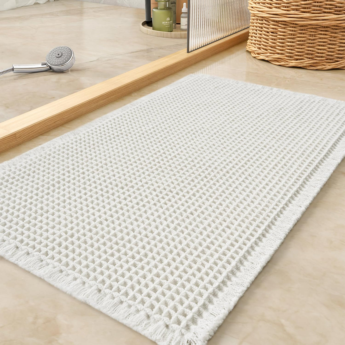 Tchdio waffle bath mat with absorbent surface for quick water pickup.