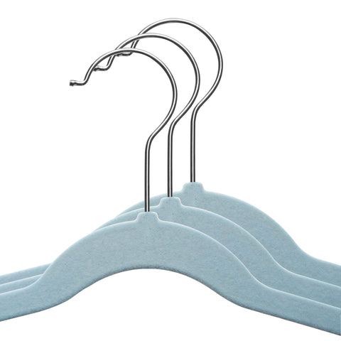 TechZoo kids clothes neatly organized on blue velvet hangers.