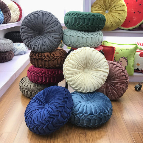 Teieas velvet round pillow resting on sofa adds subtle luxury and color pop
