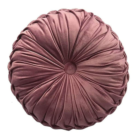 Teieas round velvet pillow with pleated design adds elegant color to a couch