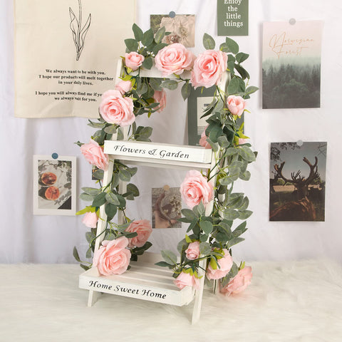 TELDRASSIL crepe material rose garland with green leaves adds realism.