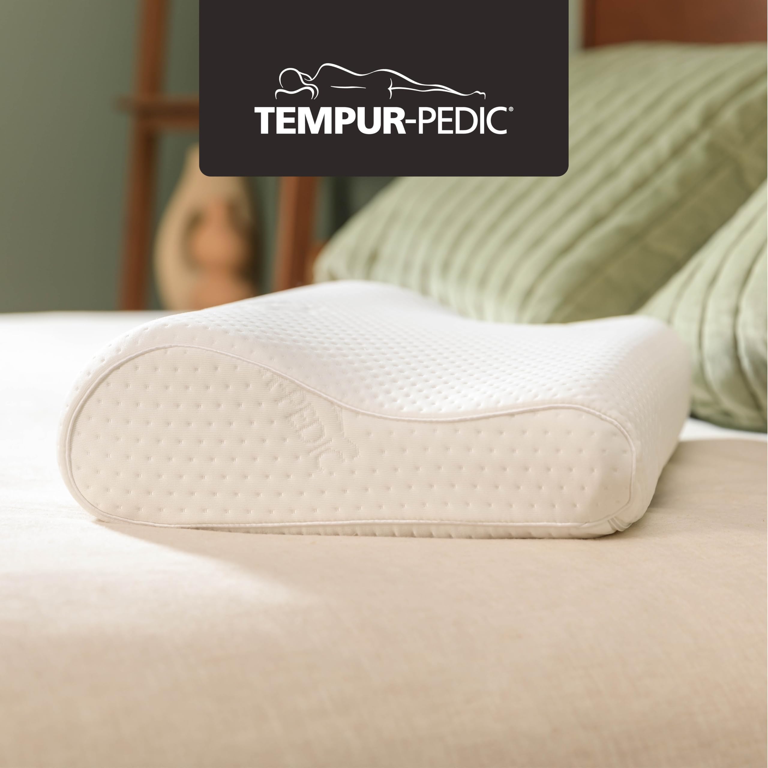 Tempur-Pedic neck pillow small profile side view for lateral sleeping alignment.