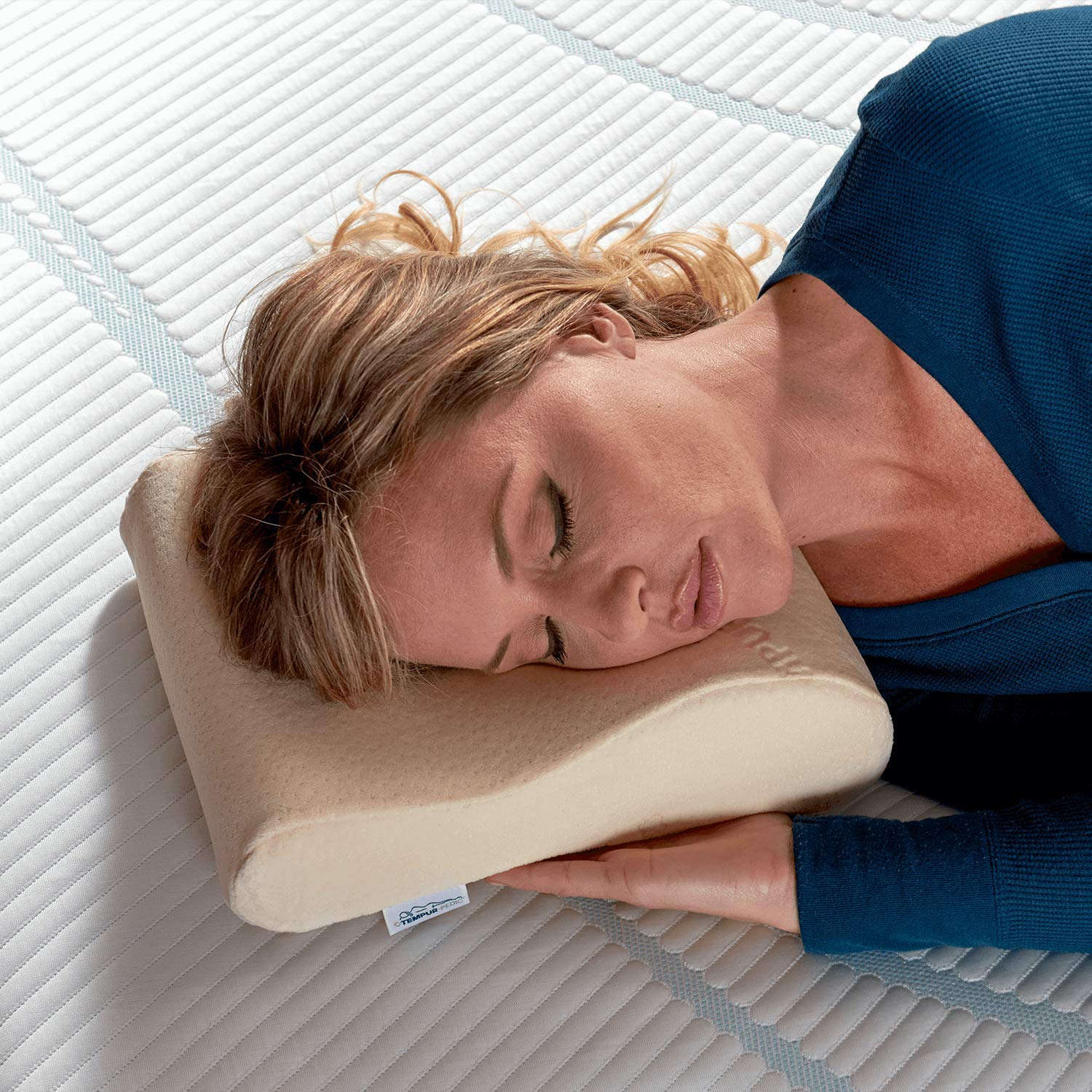 Tempur-Pedic neck travel pillow demonstrates pressure-relief support for travel nights.